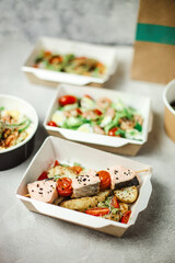 different food from delivery. catering food, takeaway. food for the company in disposable dishes