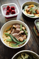 white quinoa with meat and green beans. food delivery, takeaway