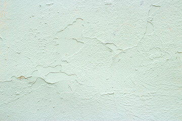 Old wall painted with green turquoise paint background image 