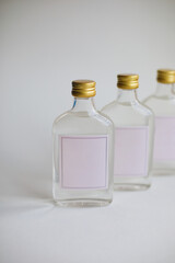 transparent glass bottles with place for text. bottles with transparent liquid on a white background. luxury cosmetics or perfume. copy space

