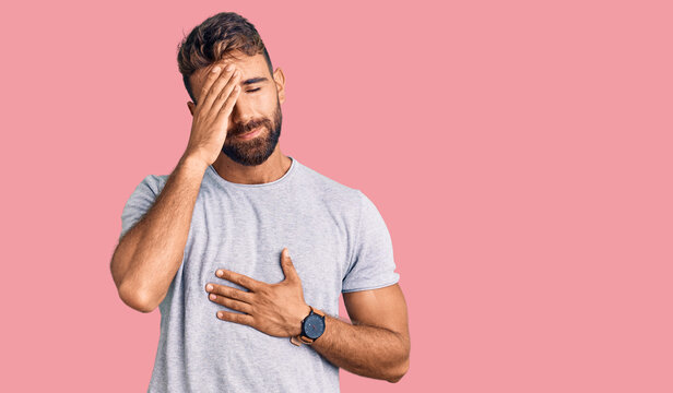 Young hispanic man wearing casual clothes touching forehead for illness and fever, flu and cold, virus sick