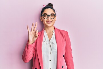 Beautiful middle eastern woman wearing business jacket and glasses showing and pointing up with fingers number three while smiling confident and happy.