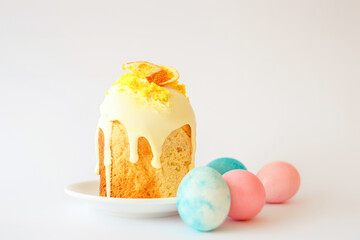 Easter bake and blue and pink colored eggs on white background. Traditional easter food of christians.
