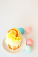 Easter bake and blue and pink colored eggs on white background. Traditional easter food of christians.