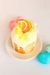 Easter bake and blue and pink colored eggs on white background. Traditional easter food of christians.