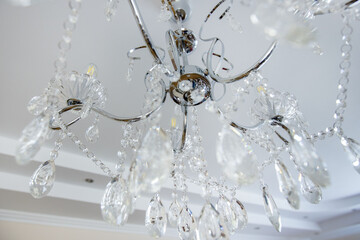 Chandelier decoration in living room. Crystal glass chandelier