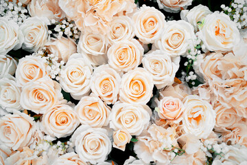 Banner of sea flowers beautiful and fragrant. A large bouquet of white roses on the wall. Flower shop. Copy space.