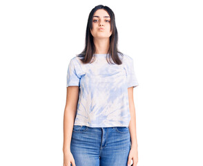 Obraz premium Young beautiful girl wearing casual t shirt puffing cheeks with funny face. mouth inflated with air, crazy expression.