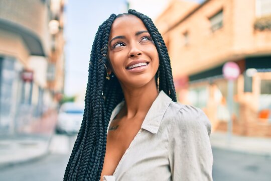 Young african american woman smiling happy walking at the city.