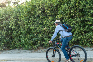 Obraz premium 40-year-old man riding a bicycle in the street