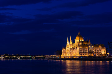 Fototapeta na wymiar Hungary, Budapest city at night, parliament by the river, reflection of lights in the water