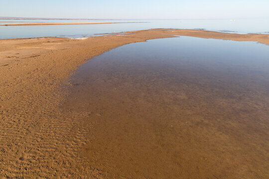 Low tide at sunset on reservoir Kapchagay.