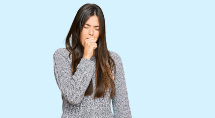 Young brunette woman wearing casual winter sweater feeling unwell and coughing as symptom for cold or bronchitis. health care concept.