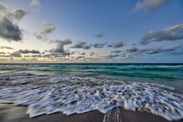 Cuba. Varadero Beach after sunset. North view. The waves roll ashore
