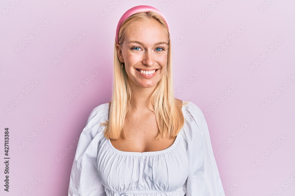 Canvas Prints young blonde girl wearing casual clothes with a happy and cool smile on face. lucky person.