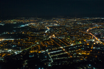 Obraz premium Night Sevastopol glows with lights. City at night from a bird's eye view.