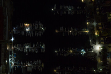 Overnight yacht parking. Night bay of Sevastopol from a bird's eye view. At night, the yachts are parked in the parking lot.