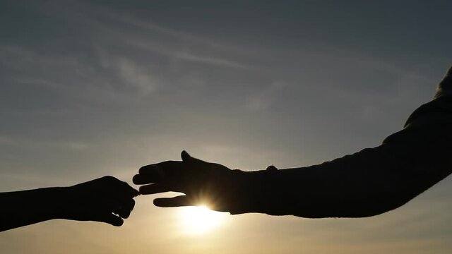 silhouette hands. Man and woman hands. Couple love. Photo. 