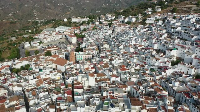 Picturesque mountain landscape with Spanish town of Competa on slopes of Sierra de Tejeda in province of Malaga on sunny autumn day
