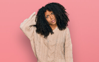 Young african american girl wearing casual clothes confuse and wonder about question. uncertain...