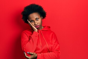 Fototapeta na wymiar Young african american woman wearing casual sweatshirt thinking looking tired and bored with depression problems with crossed arms.