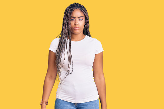 Young african american woman with braids wearing casual clothes depressed and worry for distress, crying angry and afraid. sad expression.
