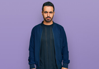 Young hispanic man wearing casual clothes skeptic and nervous, frowning upset because of problem. negative person.