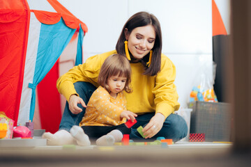 Mother and Child Playing at Home with Toy Cubes