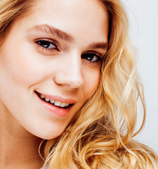 Fototapeta premium young pretty stylish blond hipster girl posing emotional isolated on white background happy smiling cool smile, lifestyle people concept