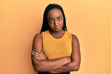 Obraz premium Young african american woman with arms crossed gesture skeptic and nervous, frowning upset because of problem. negative person.