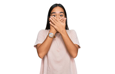 Young asian woman wearing casual clothes shocked covering mouth with hands for mistake. secret concept.
