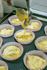 Woman Preparing Cupcakes in the kitchen