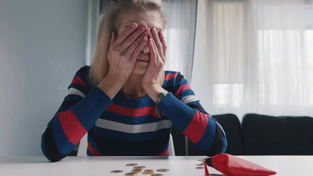 Old retired woman desperately counting coins left. High quality 4k footage
