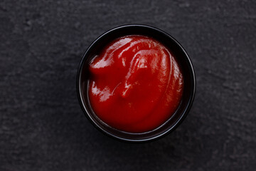 Tomato barbeque sauce dip in bowl, close up