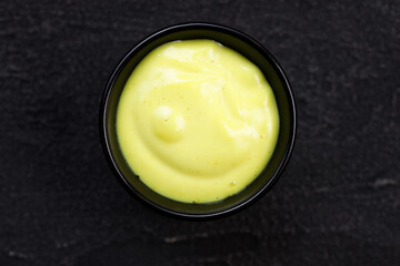 Cheese sauce dip in bowl, condiment for tasty food