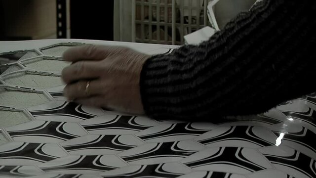 Soccer Ball Production, Hands of a Male Worker in a Soccer Ball Factory. Close Up.