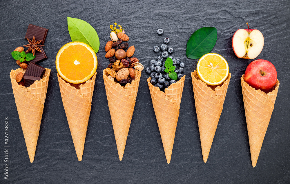 Poster various of ingredient for ice cream flavor in cones blueberry ,lime ,pistachio ,almond ,orange ,choc
