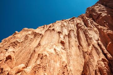 formations of the summit of a red clay mountain in the desert