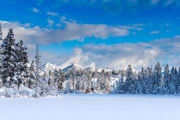Snow-covered cabin on Lake Lillian near Invermere, BC, Canada