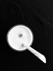 Glass of juice with flower ornament