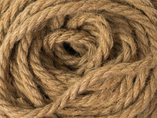 The background is made of coiled coarse twisted rope.