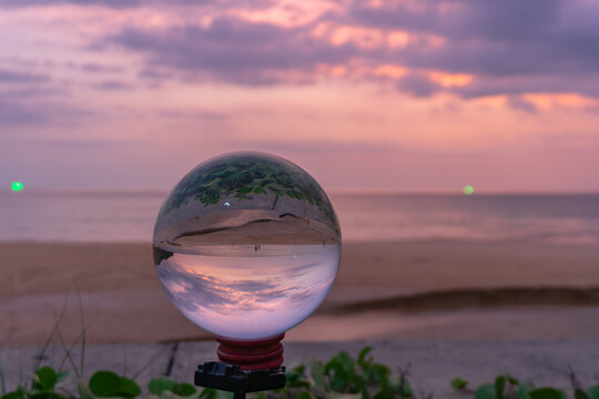 sunset in crystal ball the image that appears in an upside-down looks strange..