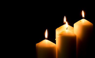 candles that are lit in the dark