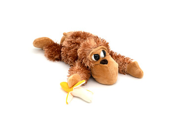 Plush toy monkey isolated on white.