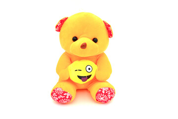 Fluffy yellow teddy bear isolated on white background.