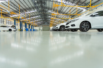auto repair service station on epoxy floor in interior car-care center