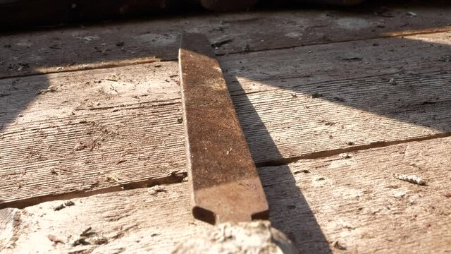 Flat lay old file tool on wooden workbench in close up pan view