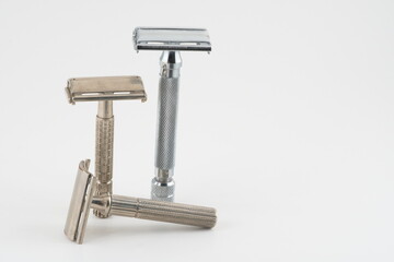 Vintage double edge safety razor for shaving, metal, nickle, and chrome. On white isolated background