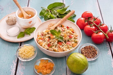 Close-up of a tabbouleh dish with surrounding ingredients