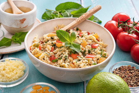 Close-up of a tabbouleh dish with surrounding ingredients